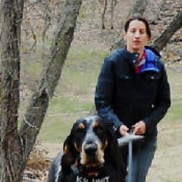 woman walking her dog outside